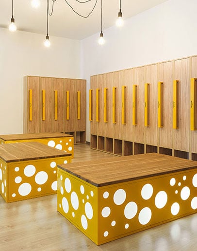 wooden-lockers-in-modern-illuminated-kindergarten-cloakroom-1-vert